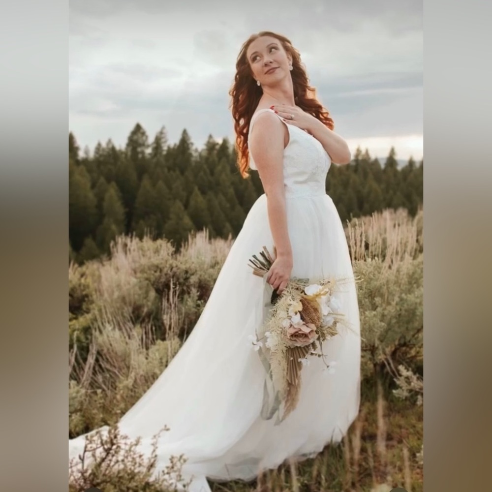 Plunging v neck wedding dress. Tulle and lace